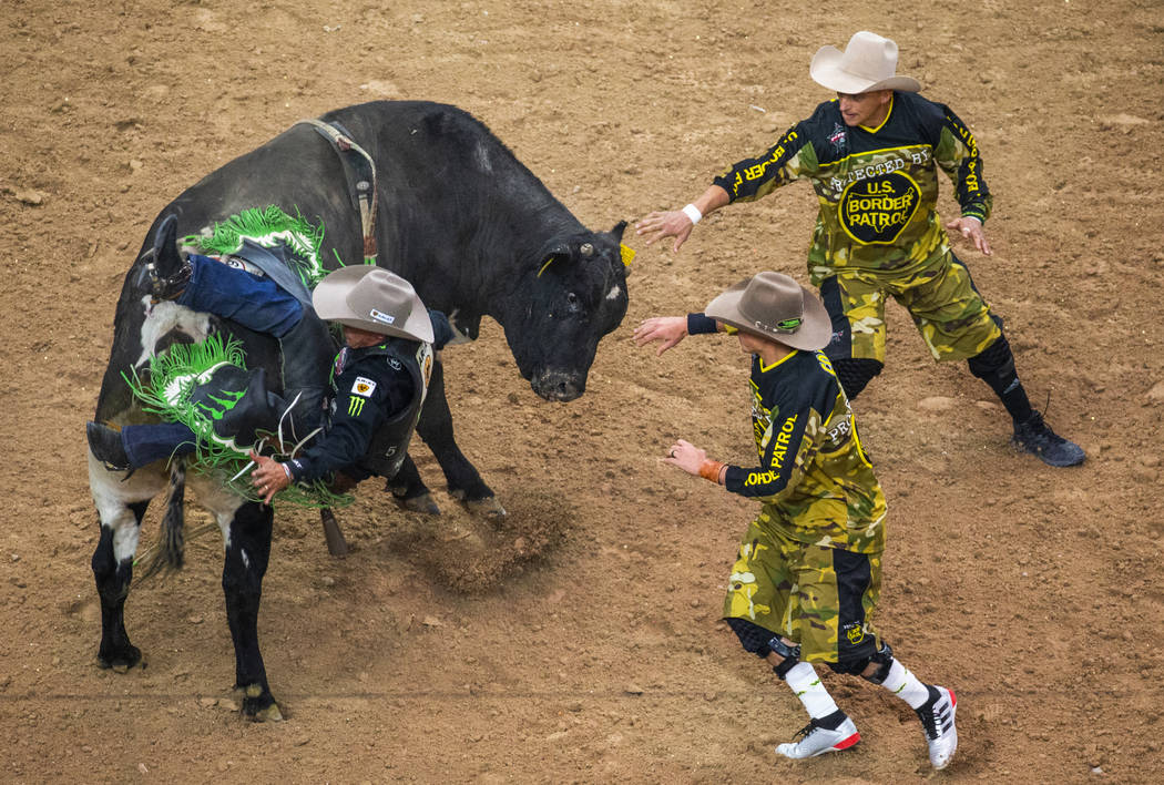 Marco Eguchi falls off the back of Wild Child during the third day of the PBR World Finals at T ...