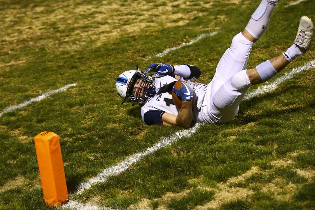 Foothill's Thomas Fisher-Welch (18) catches the ball for a touchdown during the first half of a ...