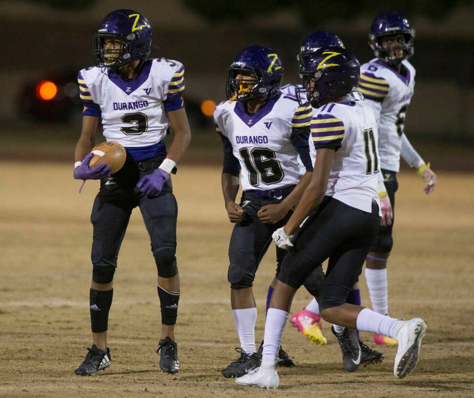 Durango's Jaxon Young (3) celebrates with teammates Sebastian Plascencia (16), Damon Knighten ( ...