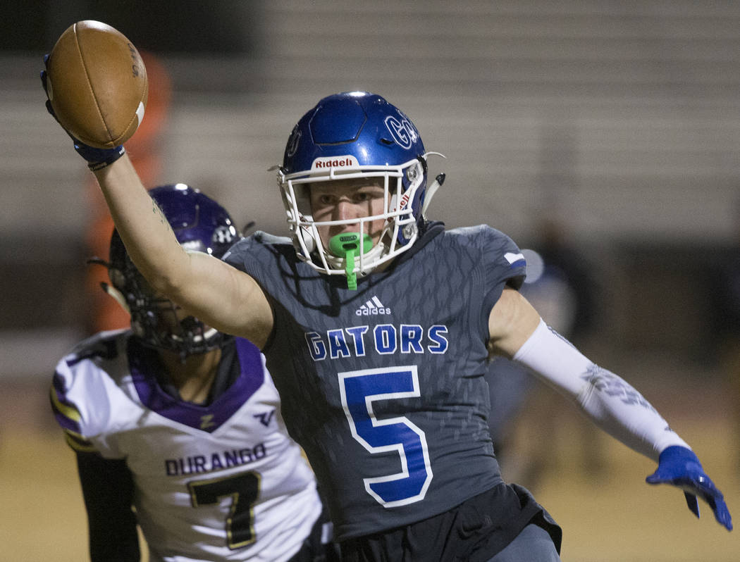 Green Valley's Colin Rerecich (5) sprints into the end zone past Durango's Jayden Young (7) in ...