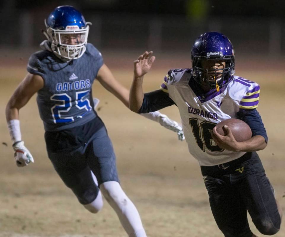 Durango's Sebastian Plascencia (16) breaks a big run past Green Valley's George Faber (25) in t ...