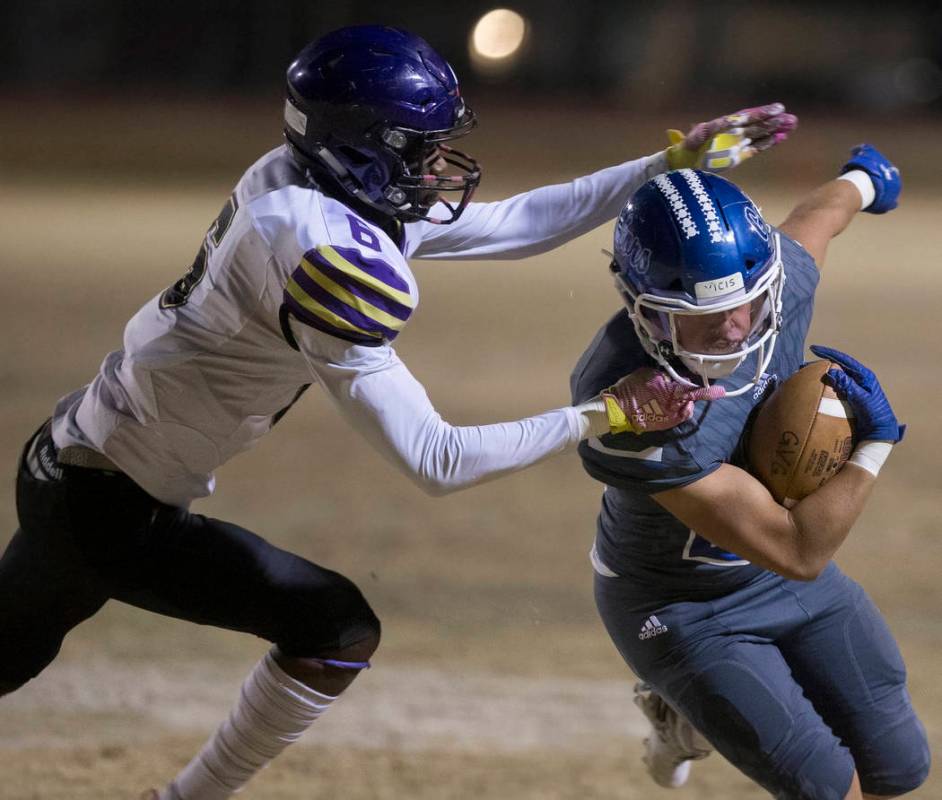 Green Valley's Noah Hawthorne (22) turns the corner past Durango's Michael Hayword (6) in the f ...