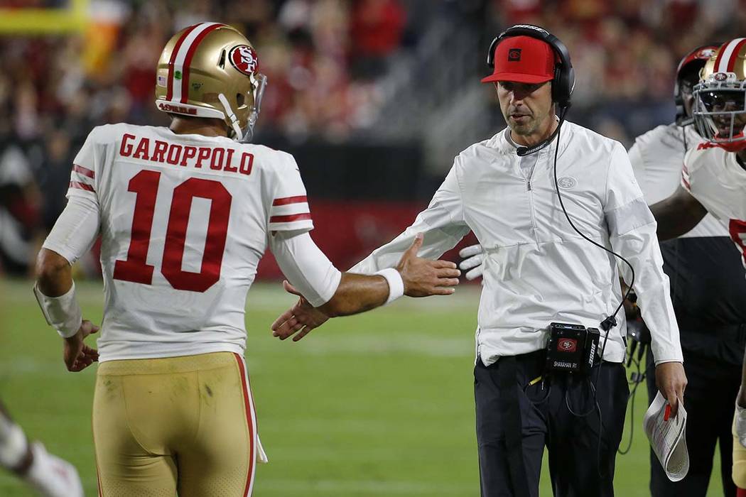 San Francisco 49ers quarterback Jimmy Garoppolo (10) greets San Francisco 49ers head coach Kyle ...