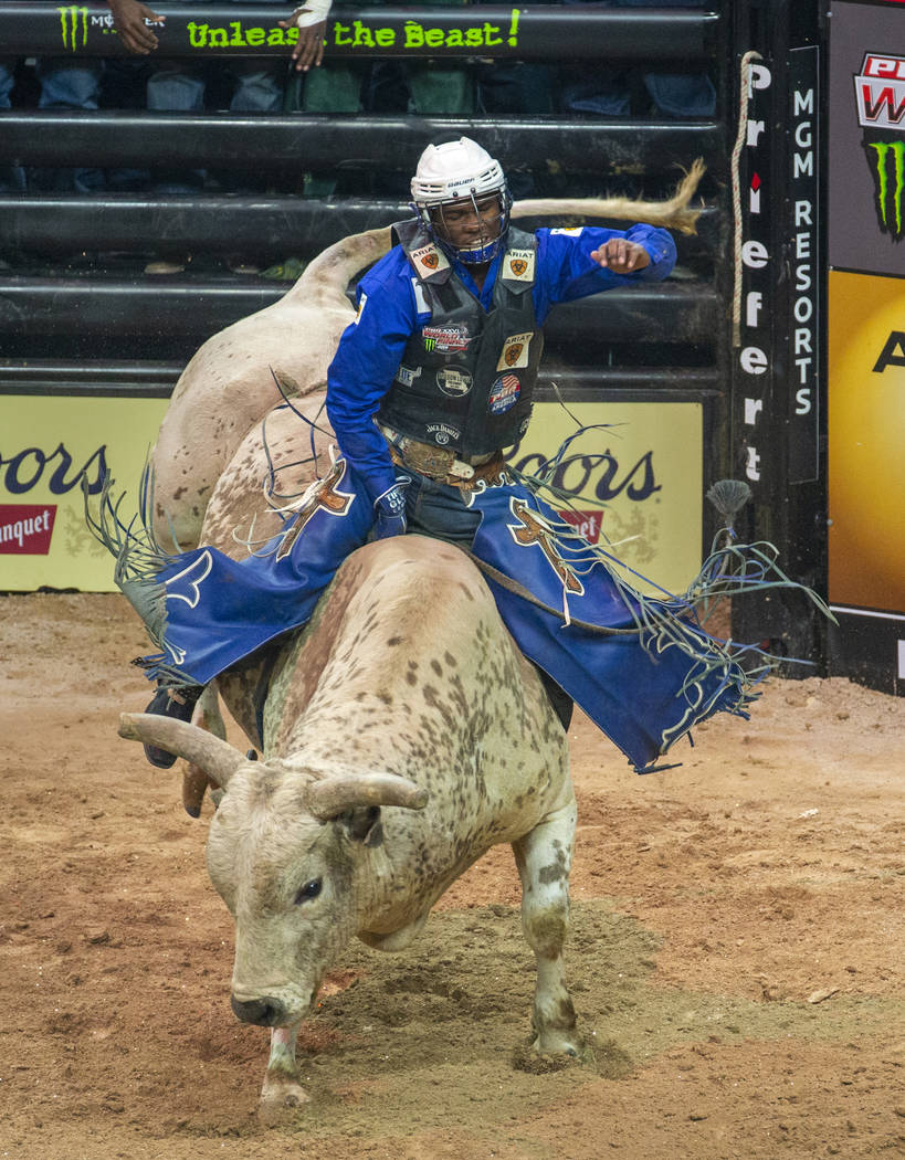 Ezekiel Mitchell dominates Lester Gillis during the third day of the PBR World Finals at T-Mobi ...