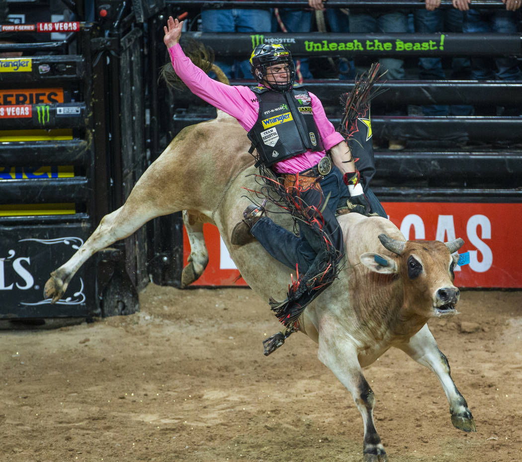 Ramon de Lima leans back on Ridin Solo during the third day of the PBR World Finals at T-Mobile ...