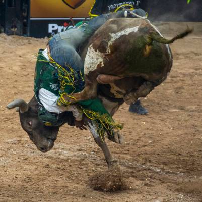 Keyshawn Whitehorse attempts to hang on to Rocket Man during the third day of the PBR World Fi ...