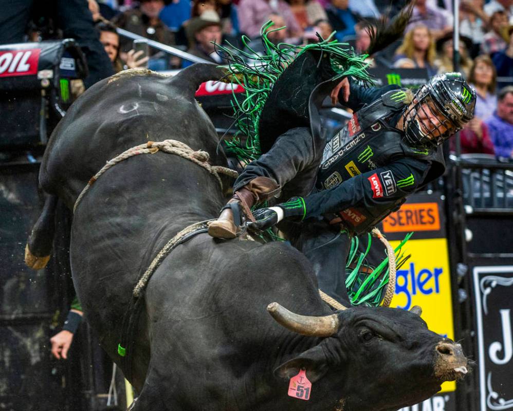 Derek Kolbaba gets sideways atop of Skeeter Peter during the fourth day of the PBR World Finals ...