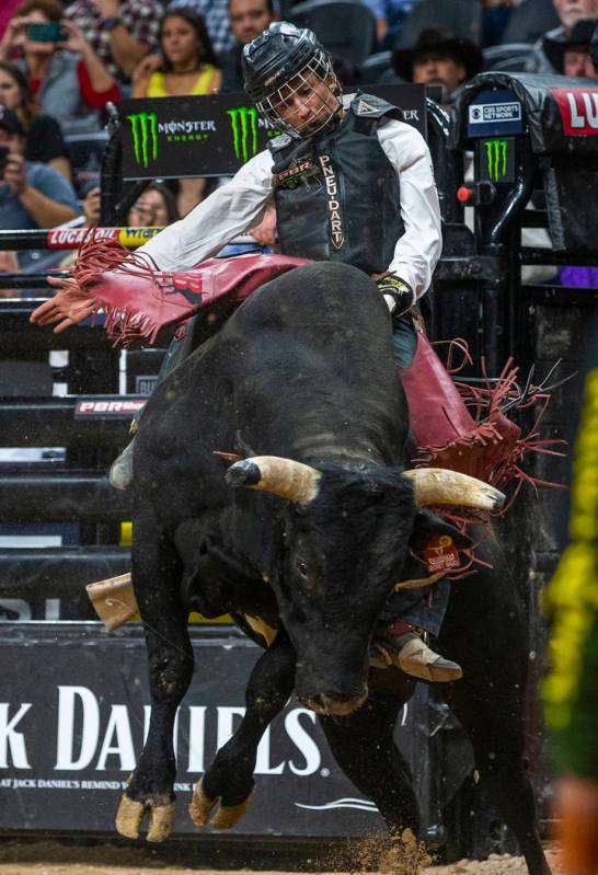 Dalton Kasel stays balanced atop of Secret Sauce during the fourth day of the PBR World Finals ...
