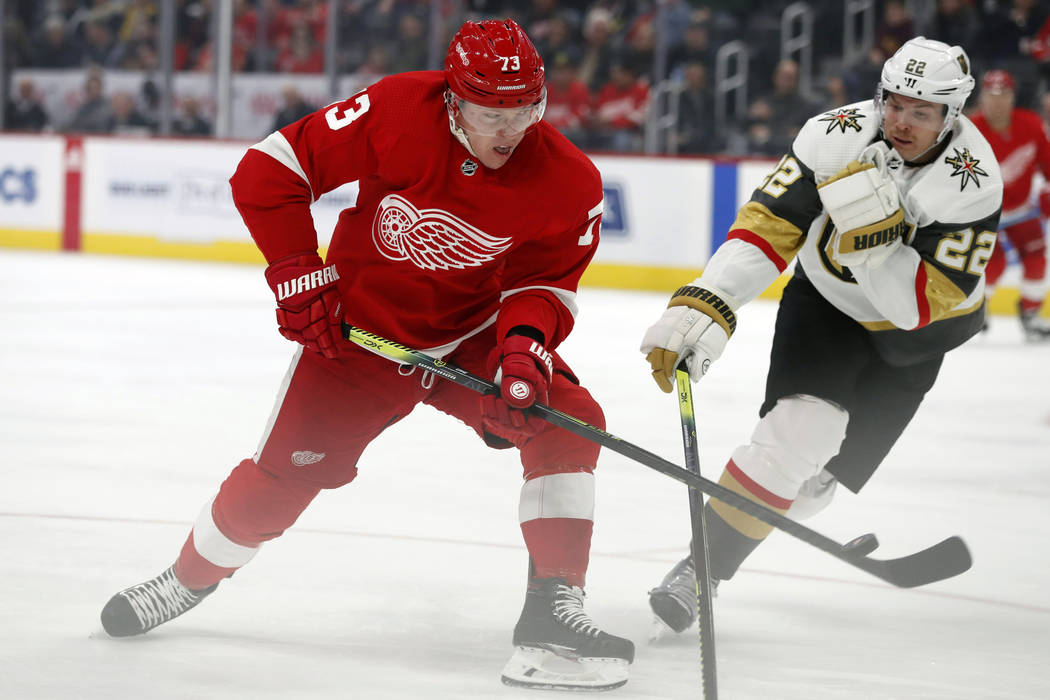 Detroit Red Wings left wing Adam Erne (73) shoots the puck past Vegas Golden Knights defenseman ...