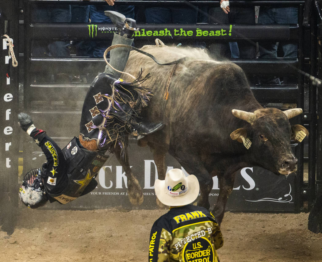 Matt Triplett is tossed off of Bad Brad during the last day of the PBR World Finals at T-Mobile ...