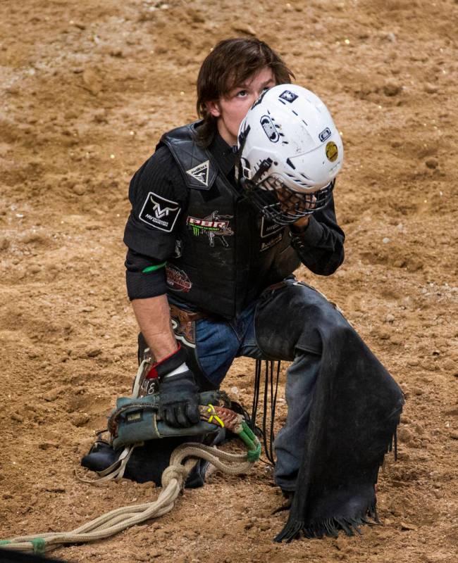 Dylan Smith gives thanks after escaping injury on Oz during the last day of the PBR World Final ...