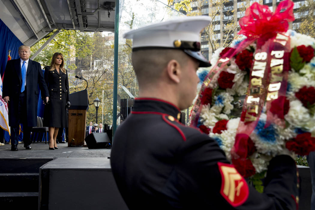 President Donald Trump and first lady Melania Trump participate in a wreath laying ceremony at ...