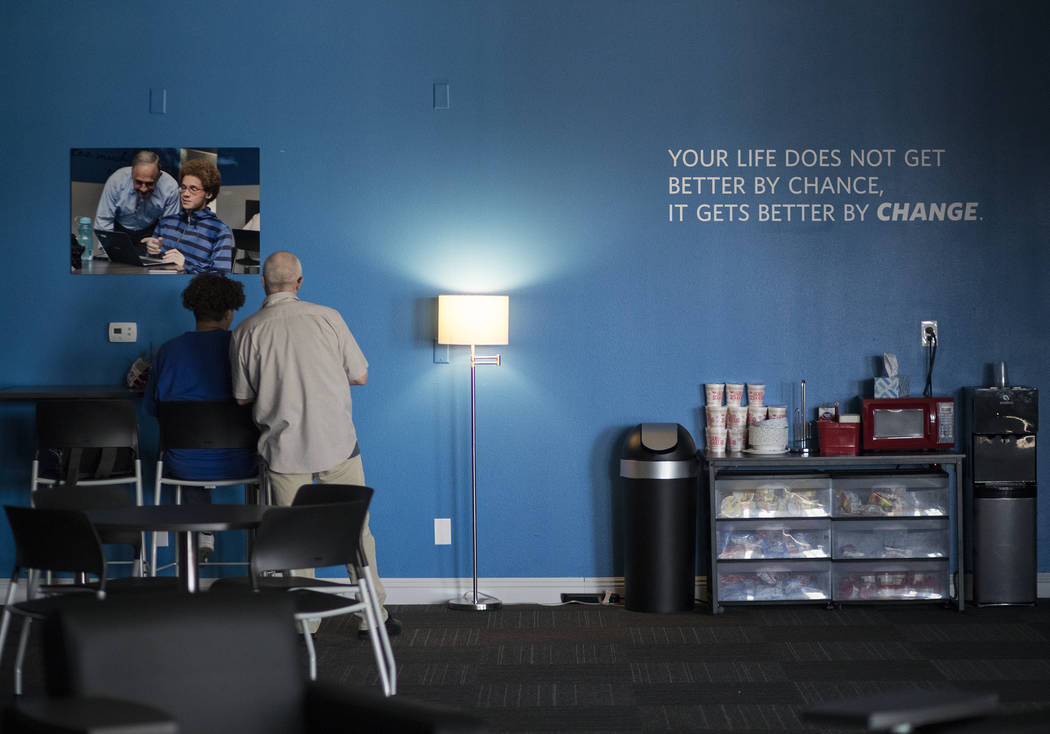 Kris Skrutvold, a science content coach, helps Elijah Wolfson, 16, at Acceleration Academy in L ...