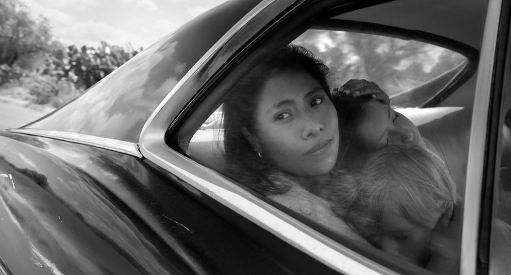 Yalitza Aparicio as Cleo, Marco Graf as Pepe, and Daniela Demesa as Sofi in Roma, written and d ...