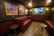 A room hidden by a wall-length portrait in the speakeasy features 1920s artwork at The Undergro ...