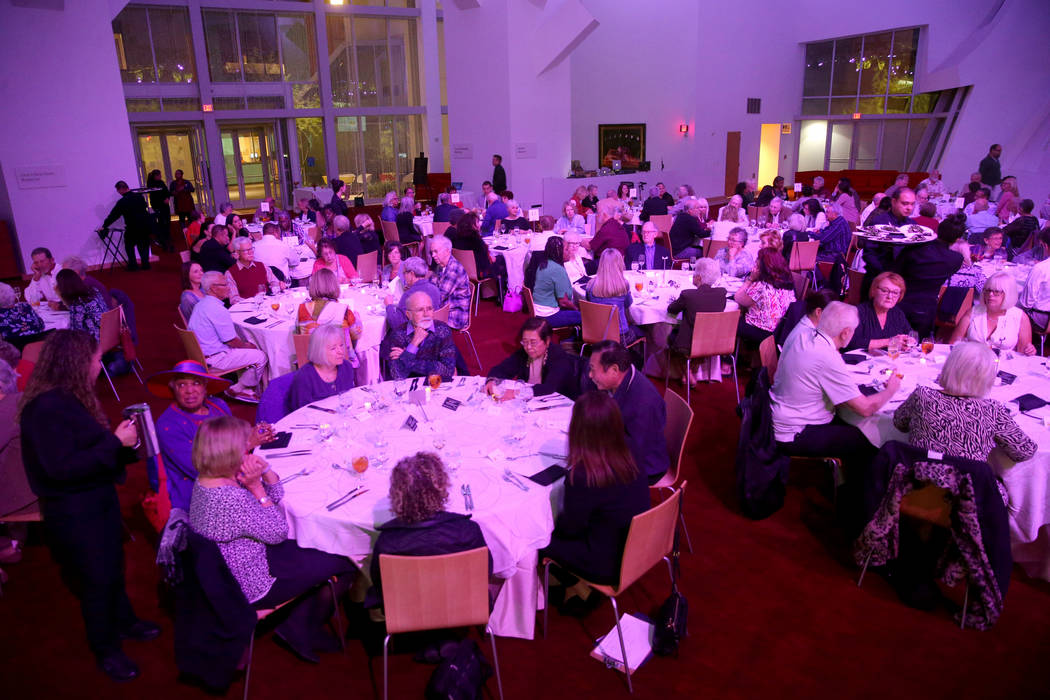 Guests talk during Death Over Dinner - Alzheimer's Edition in the Keep Memory Alive Event Cente ...