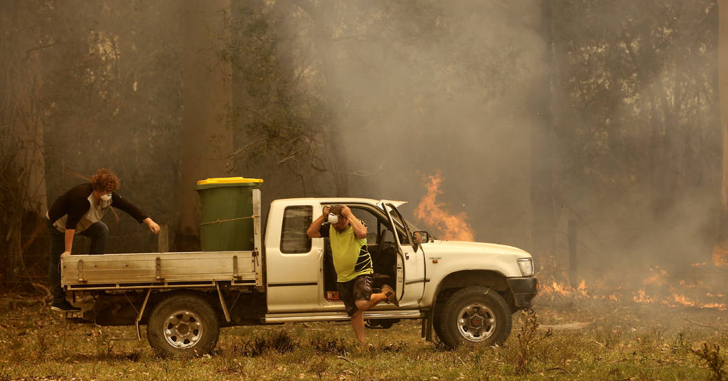 Jamie Fato prepares to stop an out of control fire entering Owen Whalan's property at Kooraingh ...