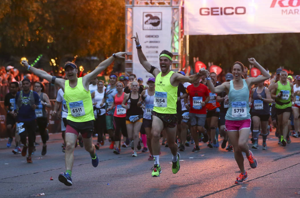 Participants, including, from left, Peter Smith, Scott Desbois, and Jen Desbois head out from t ...