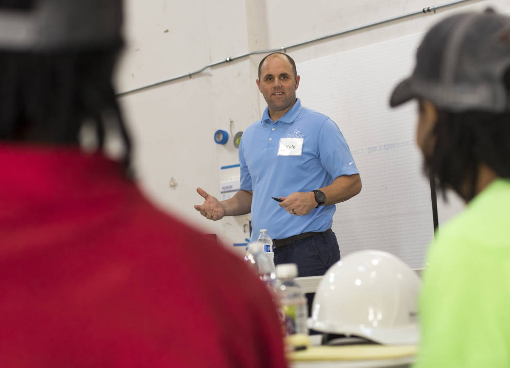 Kyle Tibbits teaches a framing class to homeless youth as part of HomeAid WORKS, a program that ...