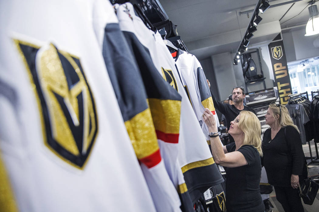 Charmaine Pennington, left, shops for Golden Knights jerseys on Wednesday, April 18, 2018, at T ...