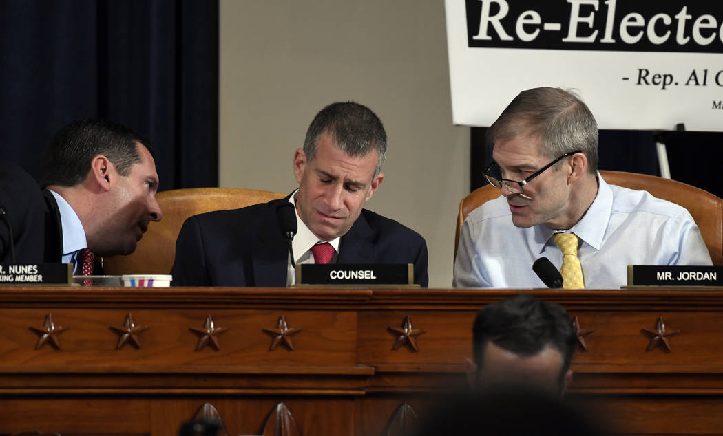 Ranking member Rep. Devin Nunes, R-Calif., left, talks to Rep. Jim Jordan, R-Ohio, right, as St ...