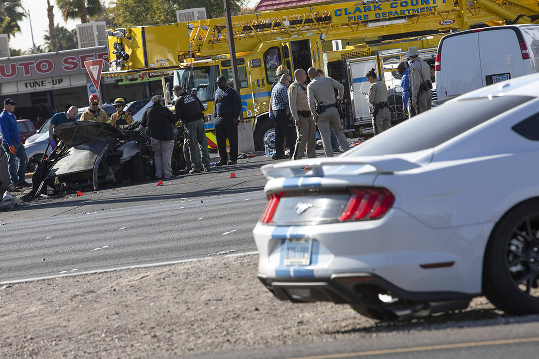 The Las Vegas Fire Department works to evacuate a vehicle involved in a suspected DUI crash on ...