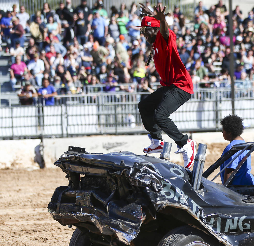 Flavor Flav jumps off a derby car during the inaugural Casino Battle Royale Demolition Derby at ...