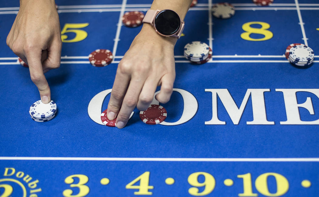 Jelena Dobras practices dealing craps at the CEG Dealer School in Las Vegas, Wednesday, Oct. 30 ...