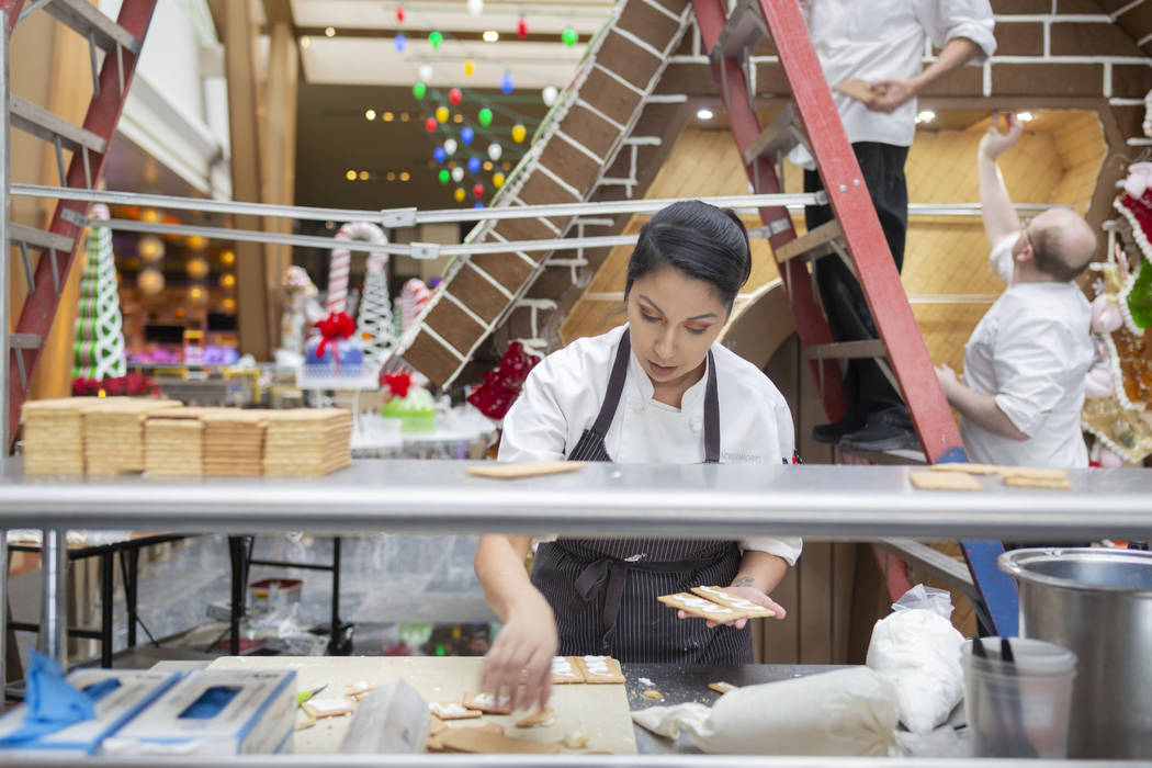 Aria Patisserie assistant pastry chef Andrea Madrid uses graham cracker and icing for the entry ...