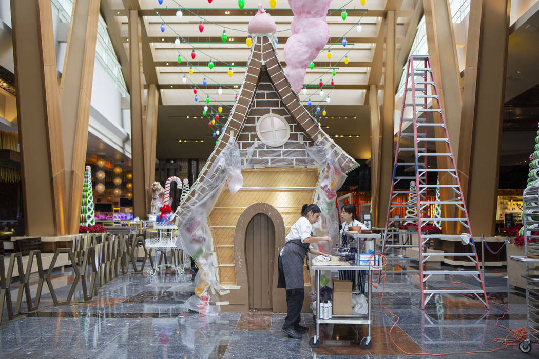 Aria Patisserie pastry chefs use a liquor apricot luster to give shine to a graham cracker wall ...