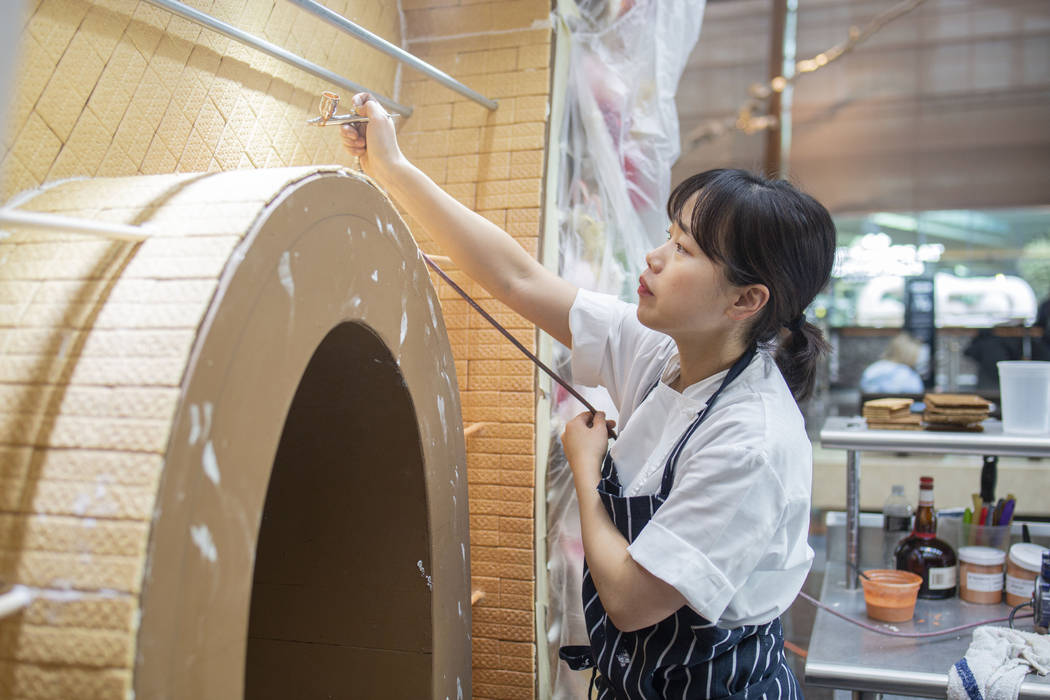 Aria Patisserie pastry chef Sunny Lee uses a liquor apricot luster to give shine to a graham cr ...