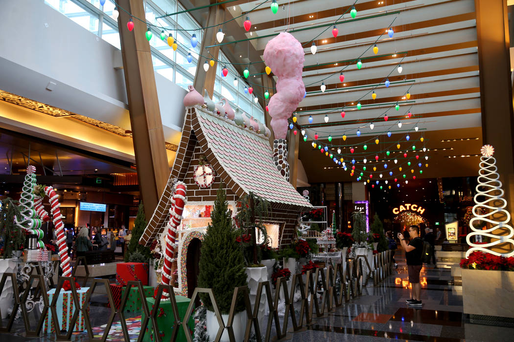 A 15-foot-tall gingerbread house in the lobby of Aria in Las Vegas Monday, Nov. 18, 2019. The t ...