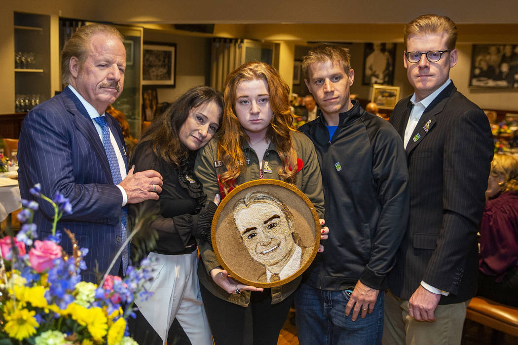 The Jimmerson family gather with the completed floragraph of Jacob Jimmerson who is being honor ...