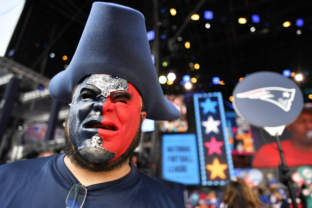 New England Patriots fan Derek Breton, of Huntsville, Ala., stands on the main stage ahead of t ...