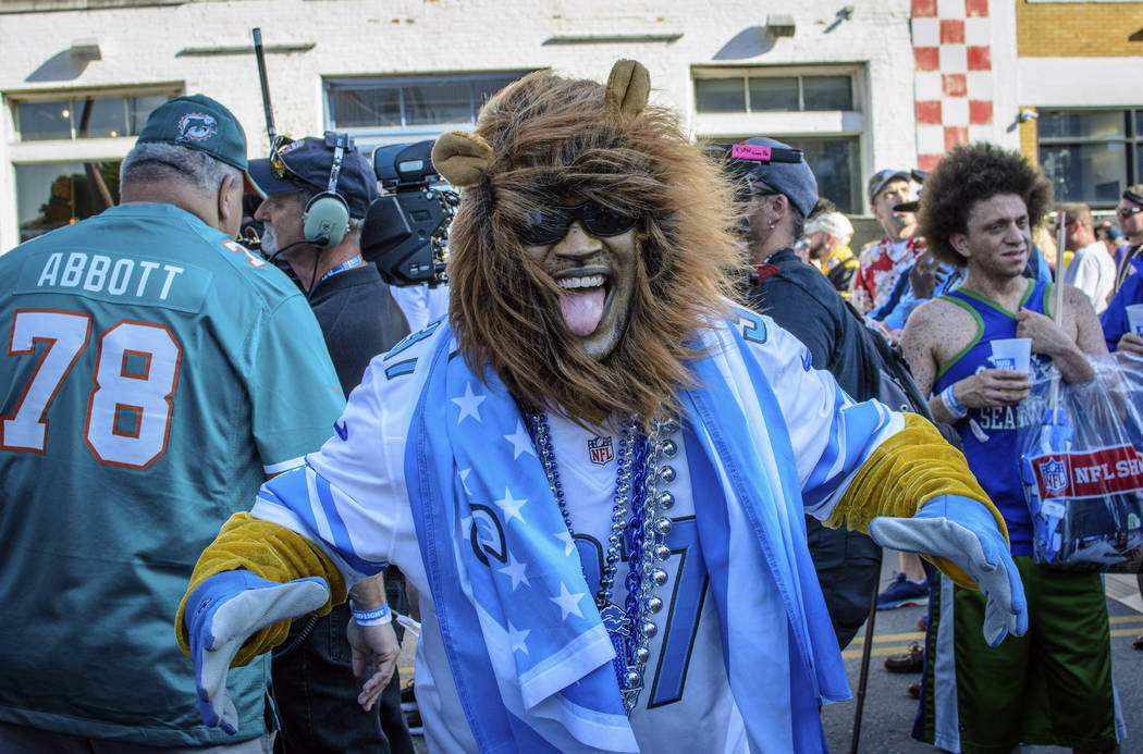 Detroit Lions fan Aaron Latimer from Saginaw, Michigan supports his team during the NFL Draft, ...