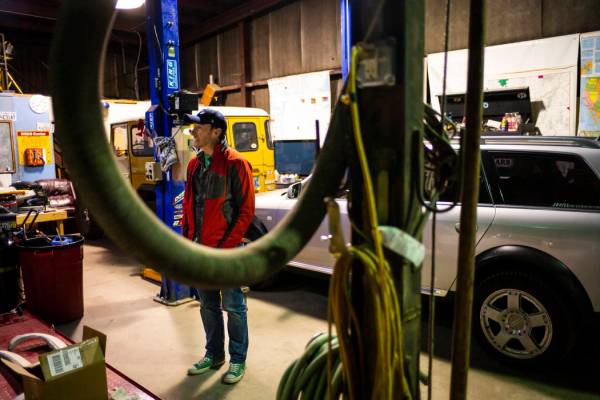 Ely Mayor Nathan Robertson talks about his garage, where he works on restoring vehicles, in Ely ...