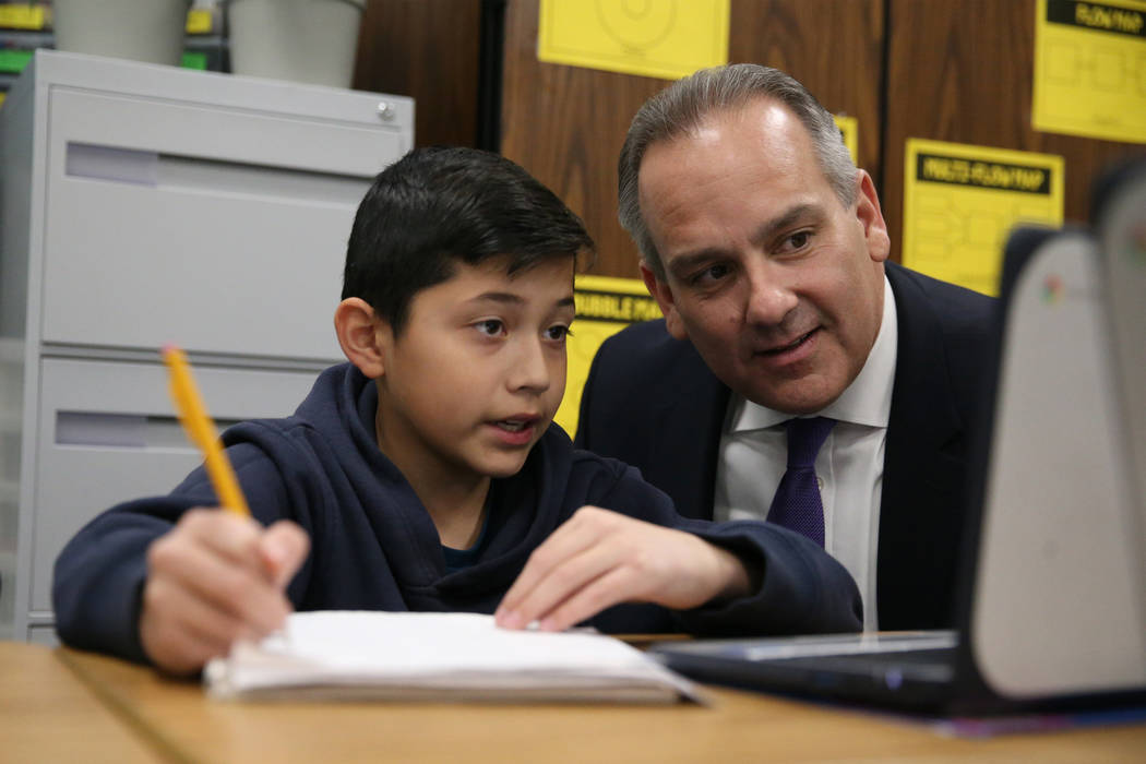 Fifth-grade-student Justin Lopez, 11, works on his math as Clark County School District Superin ...