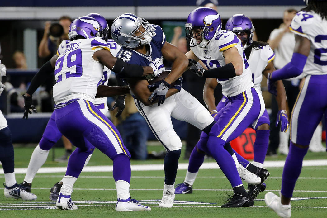 Dallas Cowboys wide receiver Amari Cooper (19) catches a pass and is stopped by Minnesota Vikin ...