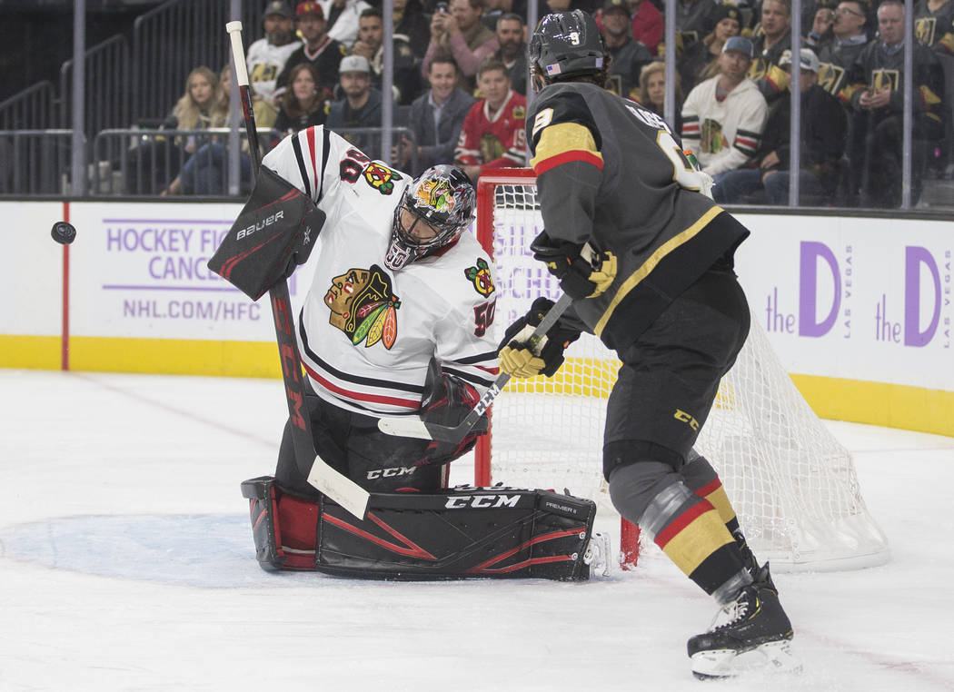 Vegas Golden Knights right wing Cody Glass (9) shoots on Chicago Blackhawks goaltender Corey Cr ...