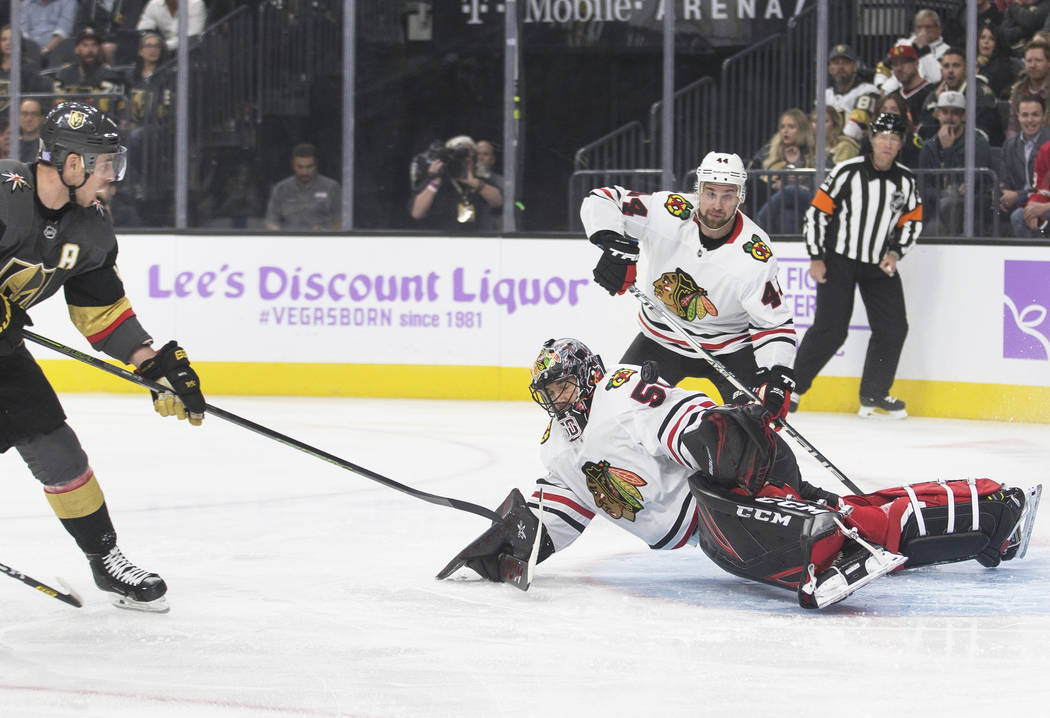 Vegas Golden Knights right wing Reilly Smith (19) shoots on Chicago Blackhawks goaltender Corey ...