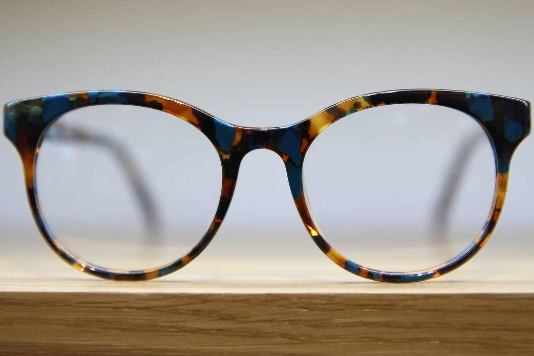 Glasses on display at the new Warby Parker store in Downtown Summerlin in Las Vegas, Thursday, ...