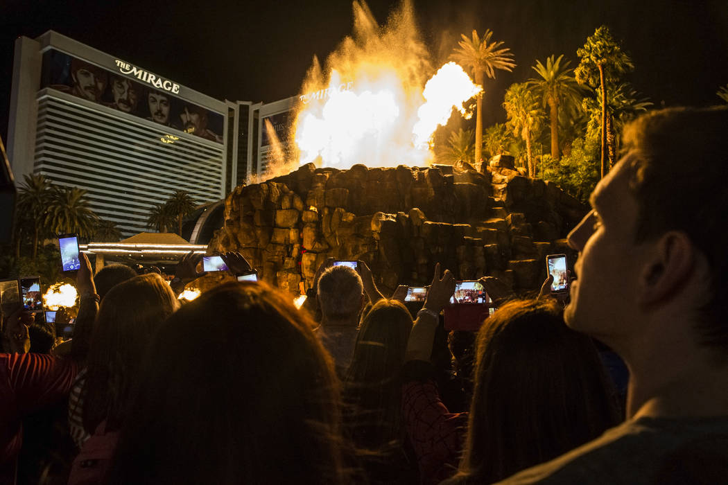 A large crowd gathers to watch the volcano at The Mirage on the Strip on Tuesday, Oct. 11, 2016 ...