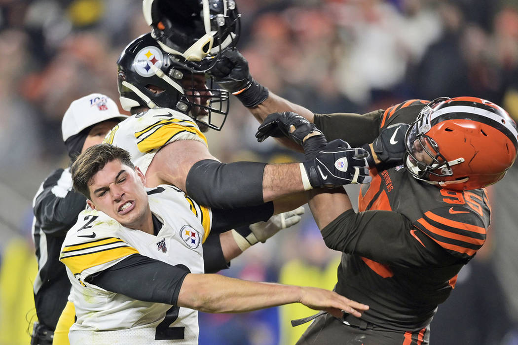 Cleveland Browns defensive end Myles Garrett (95) hits Pittsburgh Steelers quarterback Mason Ru ...