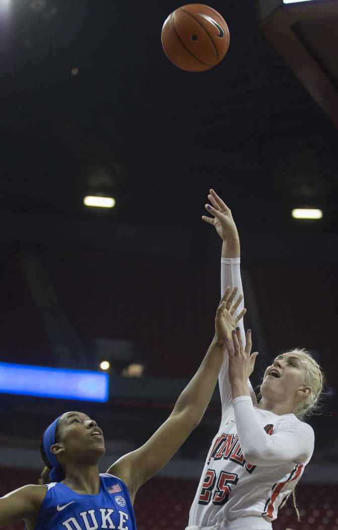 UNLV Lady Rebels guard Krista Jackman (25) shoots a jump shot over Duke Blue Devils guard Azana ...