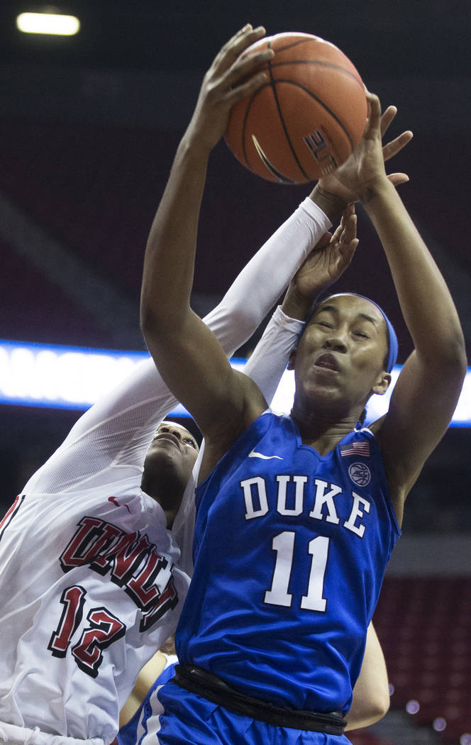 Duke Blue Devils guard Azana Baines (11) fights for a rebound with UNLV Lady Rebels forward Ann ...