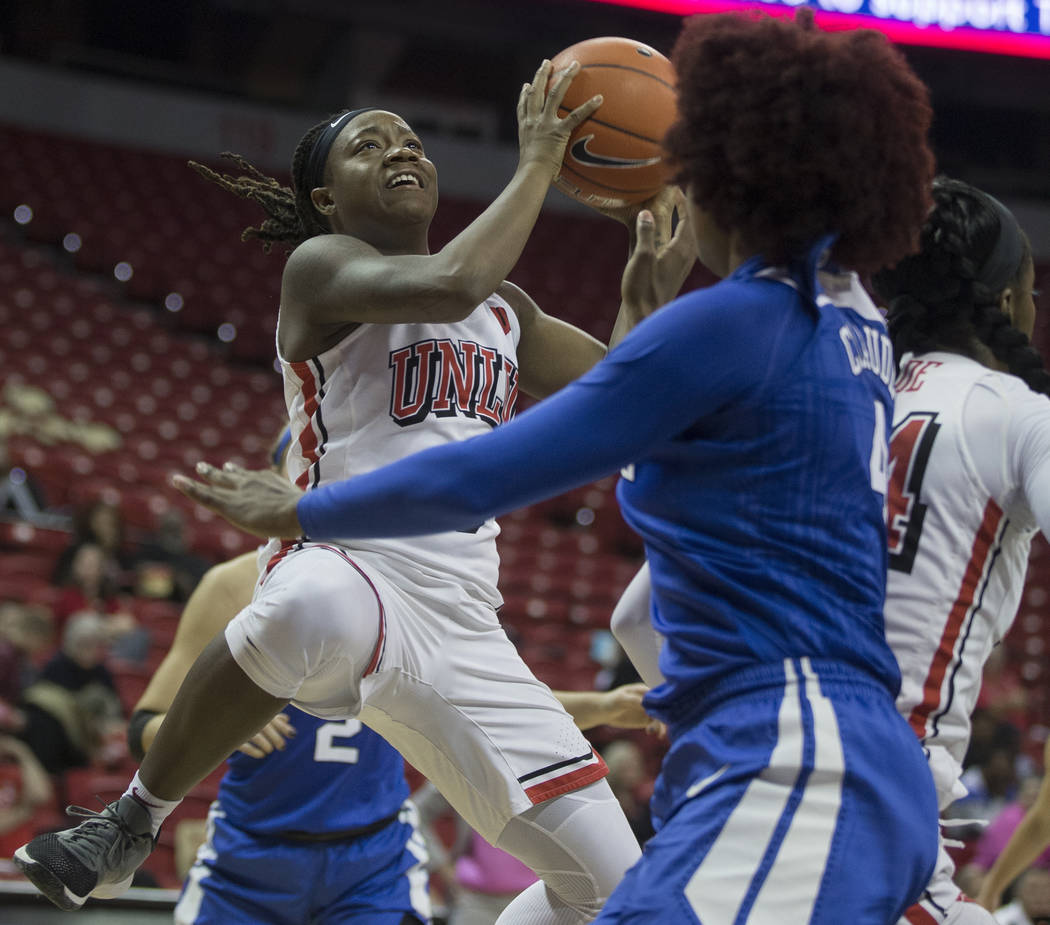 UNLV Lady Rebels guard LaTecia Smith (0) slices to the basket past Duke Blue Devils forward Jad ...