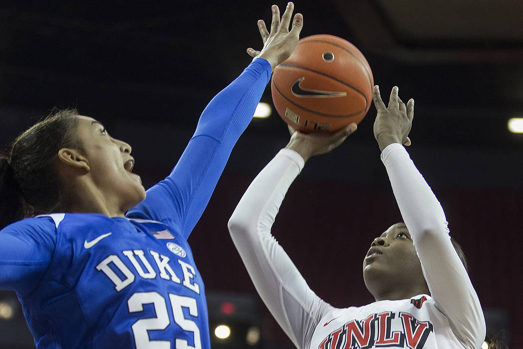 UNLV Lady Rebels forward Anna Blount (12) shoots over Duke Blue Devils forward Jade Williams (2 ...