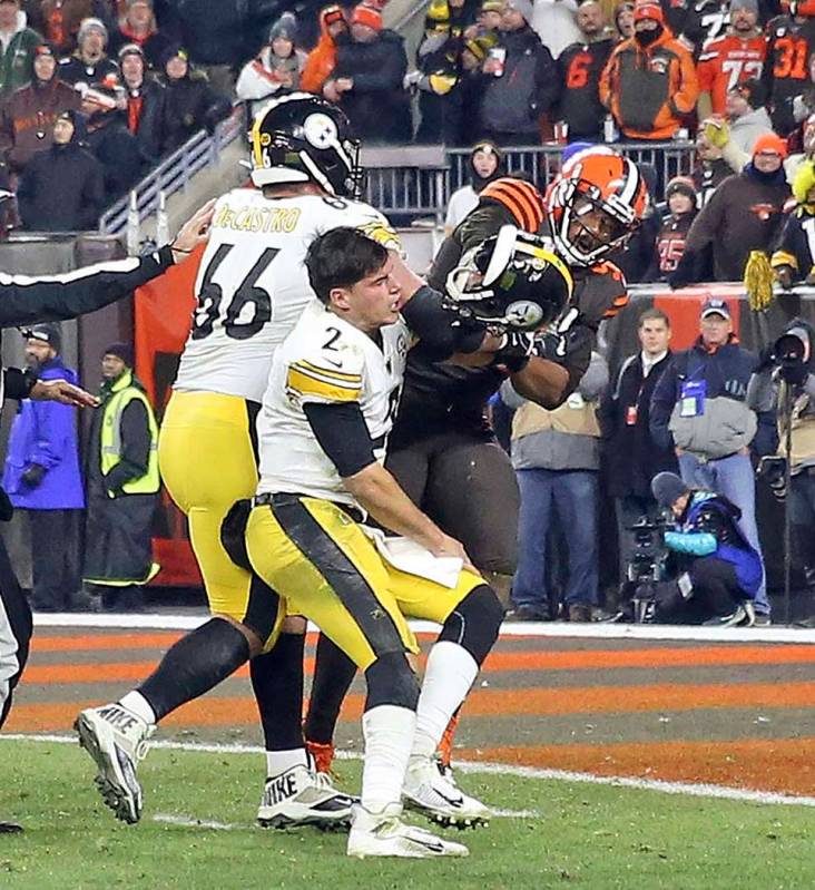 Cleveland Browns defensive end Myles Garrett (95) hits Pittsburgh Steelers quarterback Mason Ru ...