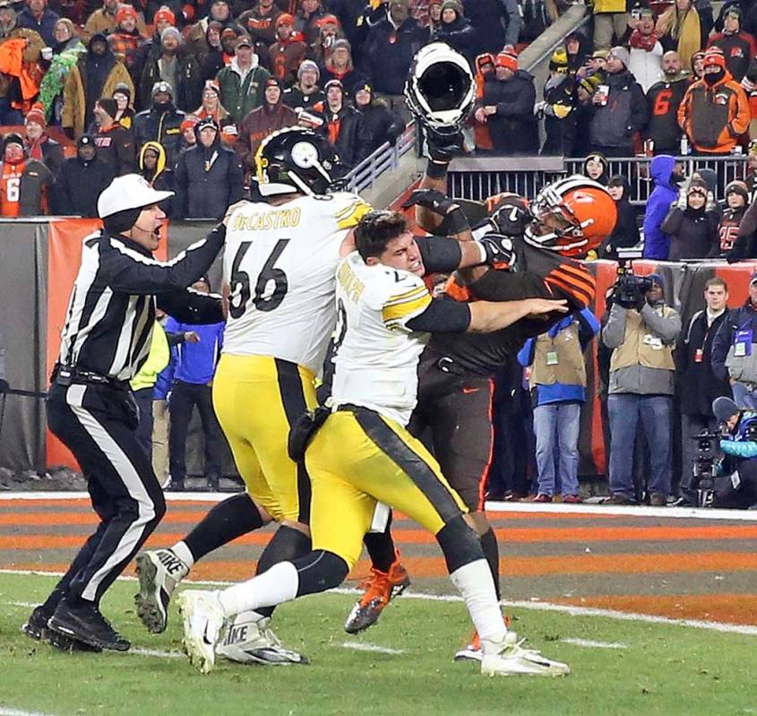 Cleveland Browns defensive end Myles Garrett (95) hits Pittsburgh Steelers quarterback Mason Ru ...