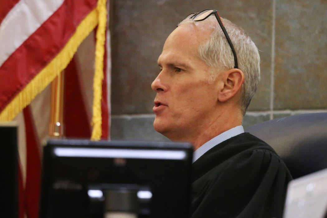 Judge Douglas Herndon gives instructions to jurors during closing statement in the trial hearin ...